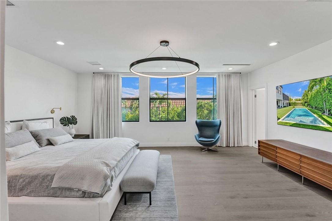 9 Tahoe Lane Sea Ranch Lakes, FL 33308 - Photo 36 of 54 a bedroom with a bed and a window