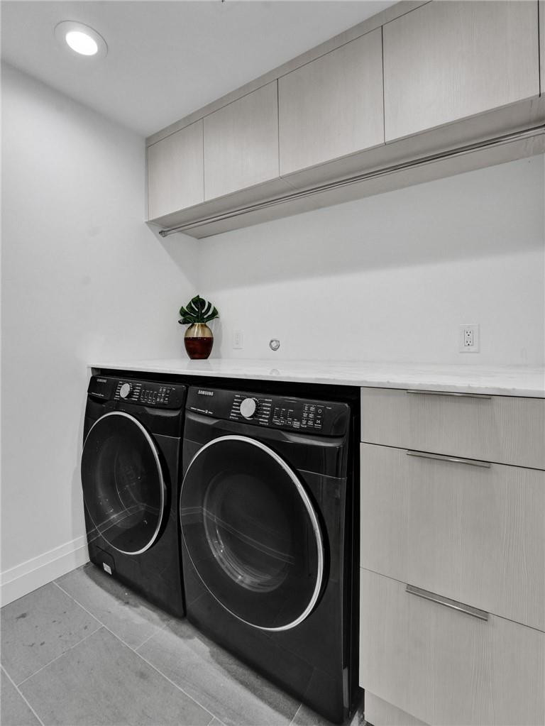 9 Tahoe Lane Sea Ranch Lakes, FL 33308 - Photo 43 of 54 a utility room with dryer and washer