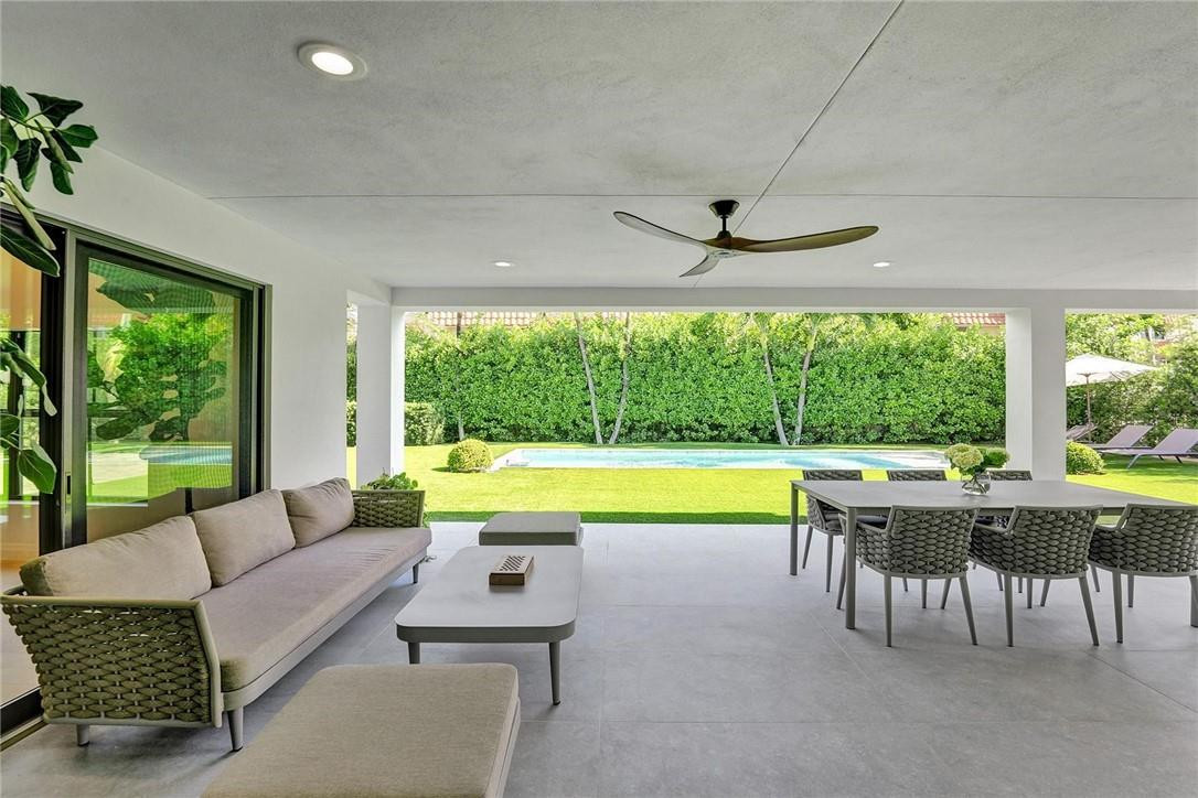 9 Tahoe Lane Sea Ranch Lakes, FL 33308 - Photo 44 of 54 a living room with furniture and a large window