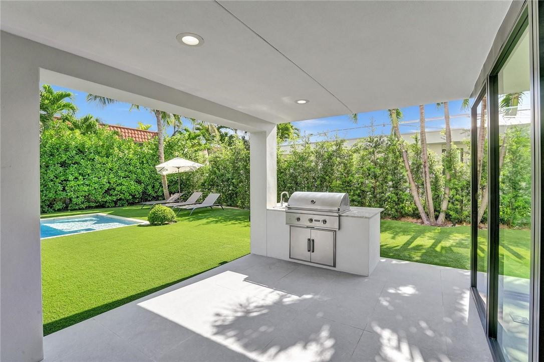 9 Tahoe Lane Sea Ranch Lakes, FL 33308 - Photo 45 of 54 a view of a backyard with garden