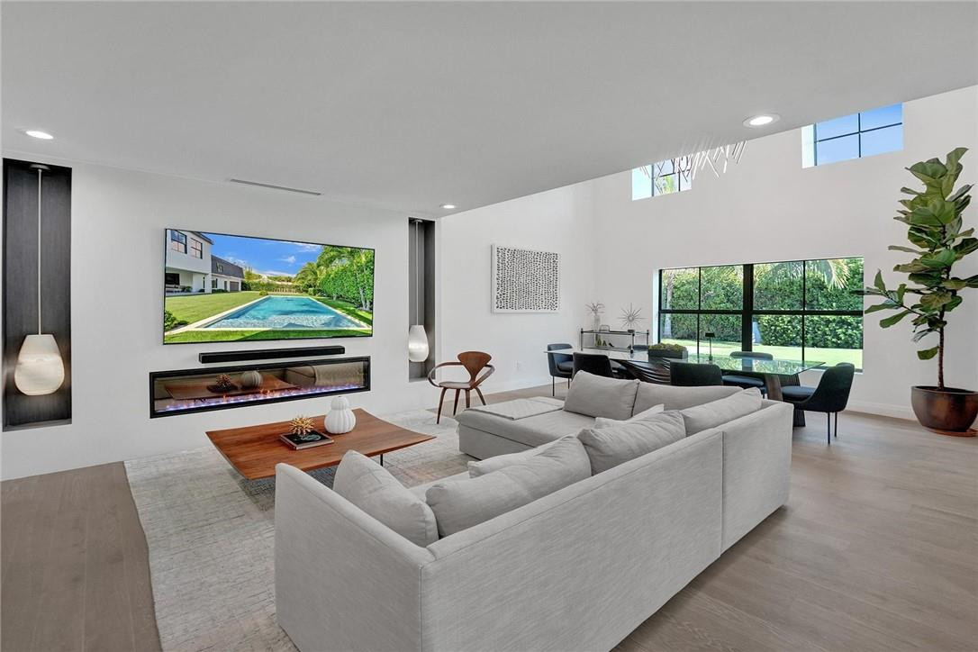 9 Tahoe Lane Sea Ranch Lakes, FL 33308 - Photo 5 of 54 a living room with furniture and a flat screen tv