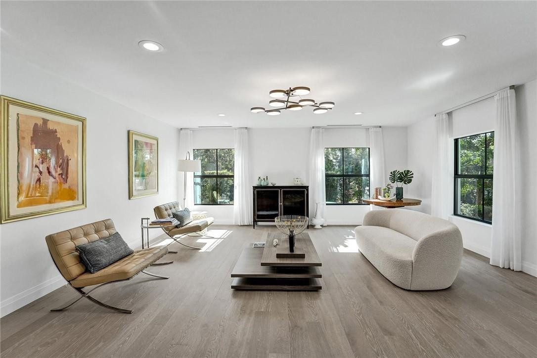 9 Tahoe Lane Sea Ranch Lakes, FL 33308 - Photo 8 of 54 a living room with furniture fireplace and window