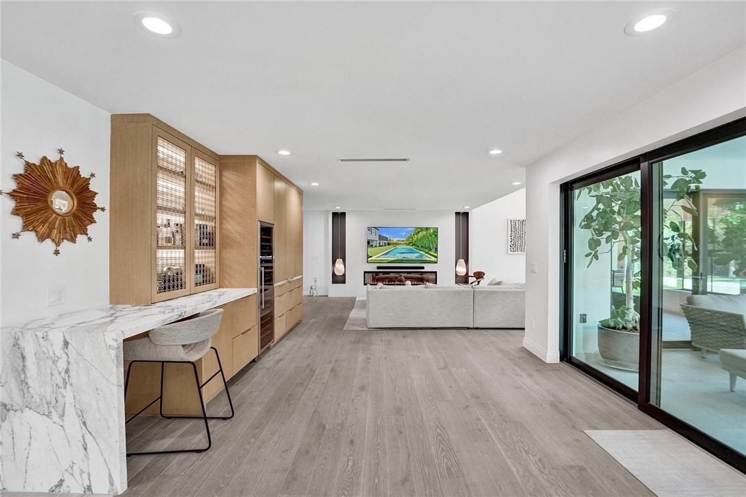 9 Tahoe Lane Sea Ranch Lakes, FL 33308 - Photo 10 of 54 a large room with a large window and furniture