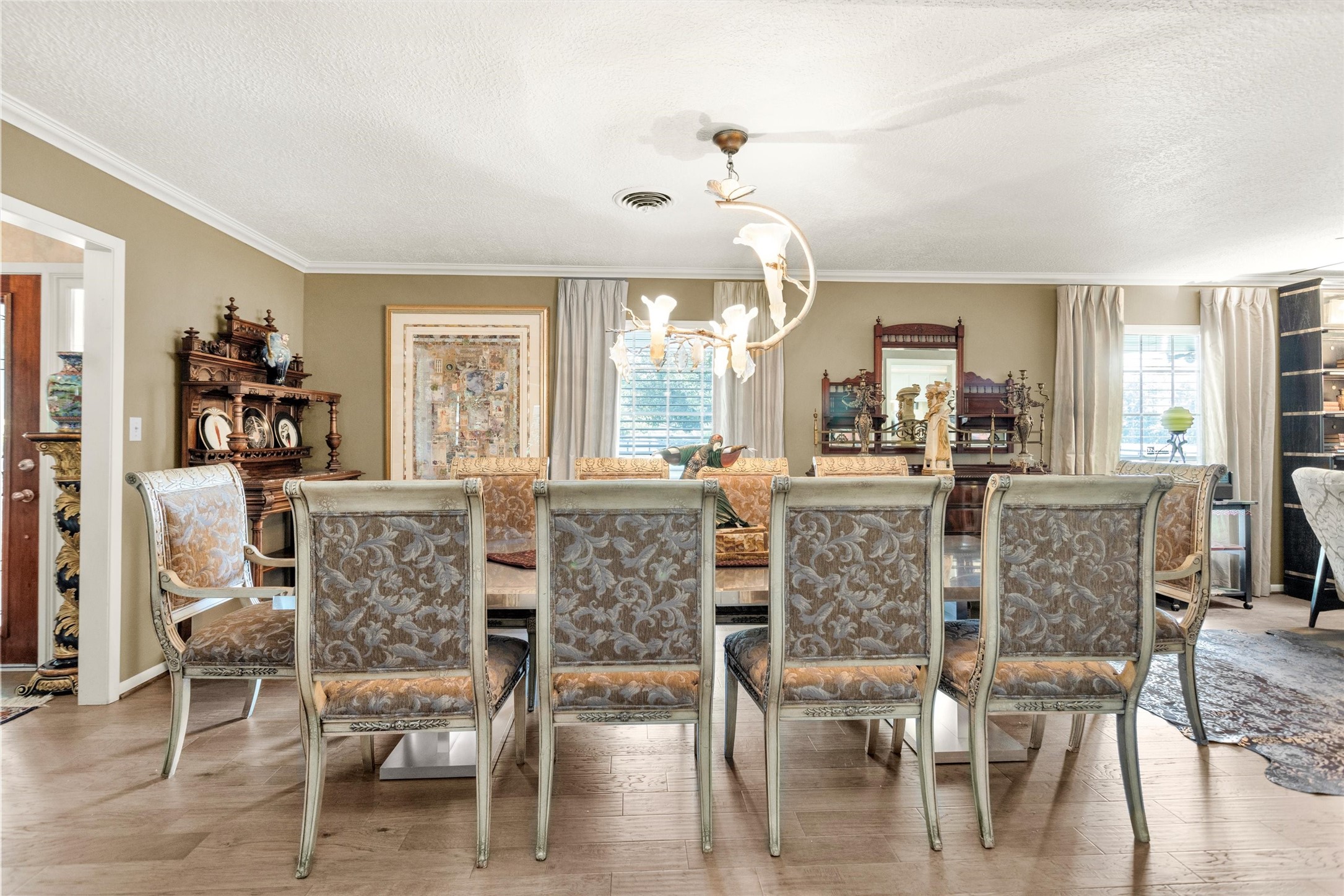 10135 Wahrenberger Road Conroe, TX 77304 - Photo 16 of 49 a view of a dining room with furniture window and wooden floor