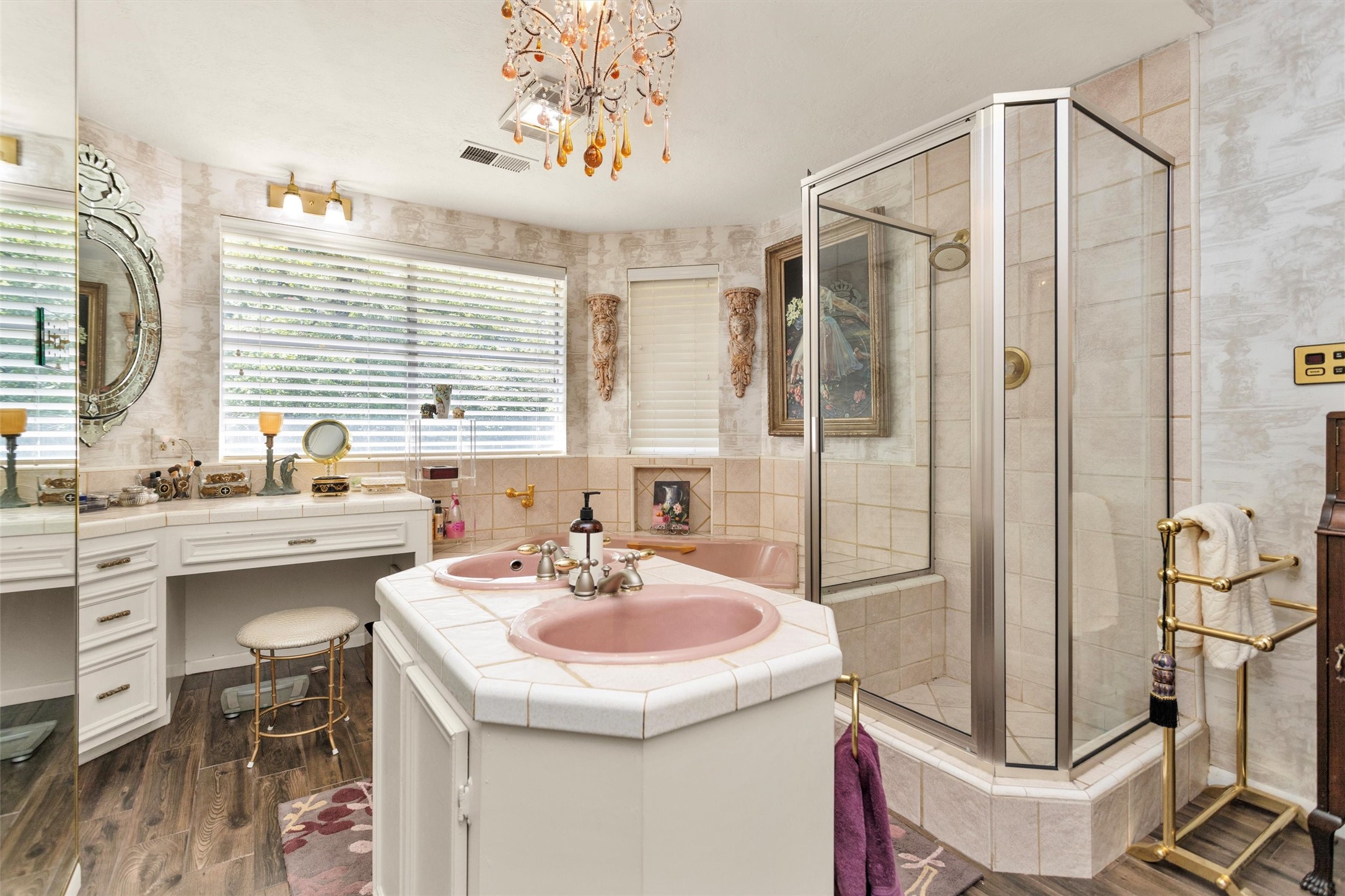 10135 Wahrenberger Road Conroe, TX 77304 - Photo 21 of 49 a bathroom with a sink a mirror a bathtub and shower