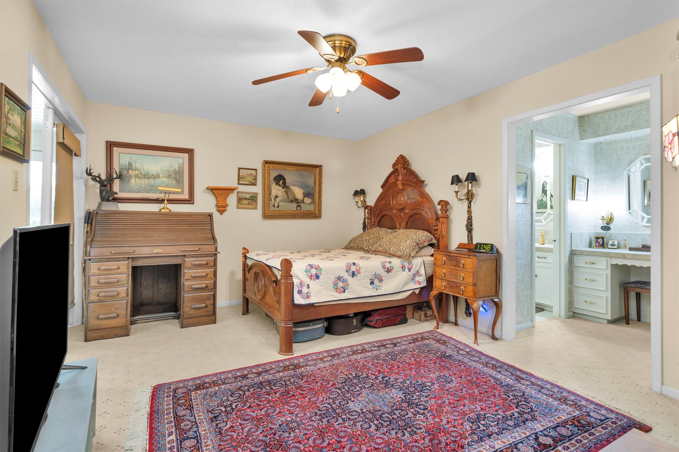 10135 Wahrenberger Road Conroe, TX 77304 - Photo 26 of 49 a living room with furniture a rug and a fireplace