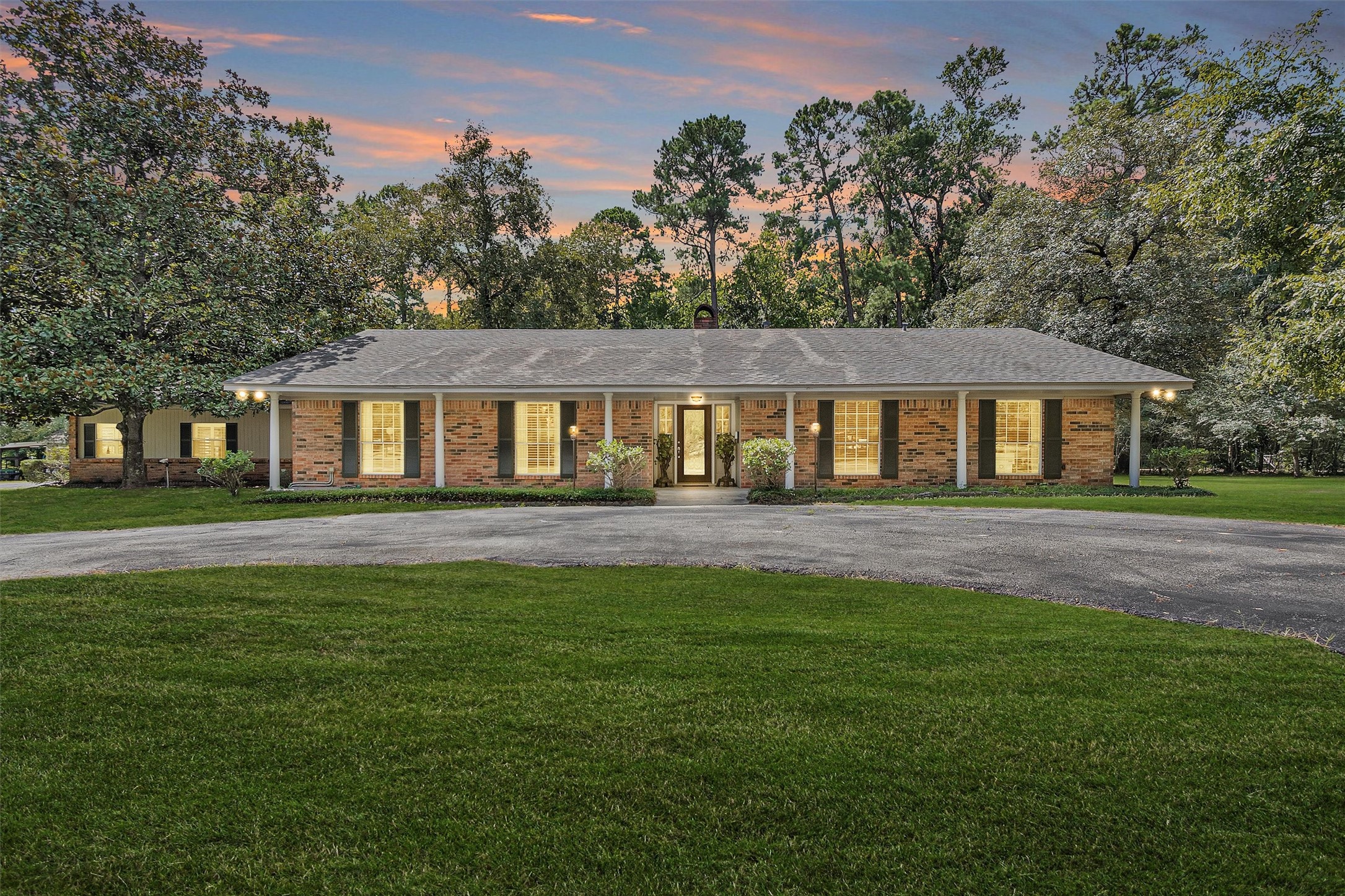 10135 Wahrenberger Road Conroe, TX 77304 - Photo 3 of 49 a front view of a house with a yard