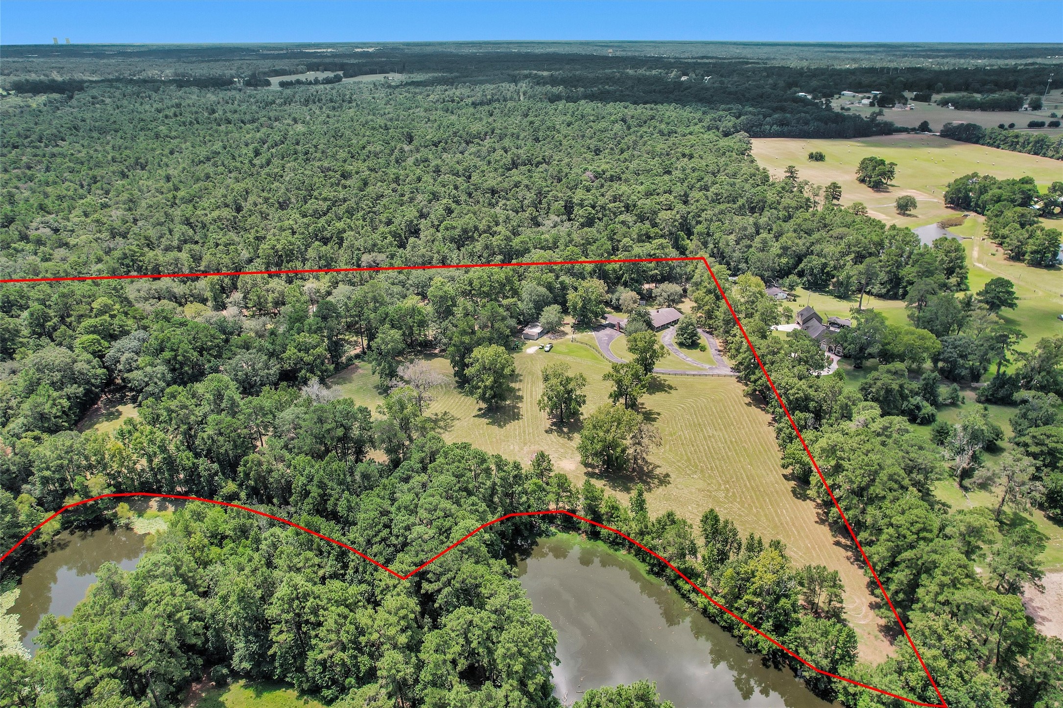 10135 Wahrenberger Road Conroe, TX 77304 - Photo 49 of 49 a view of a lake with a mountain in the background