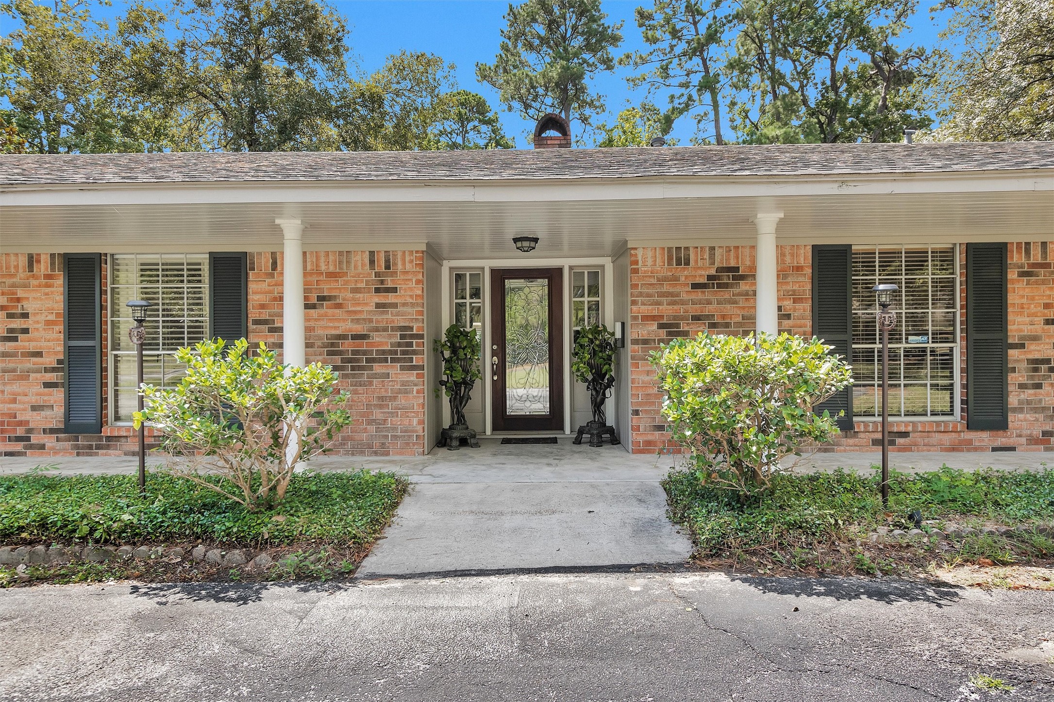 10135 Wahrenberger Road Conroe, TX 77304 - Photo 6 of 49 front view of a house with a small yard
