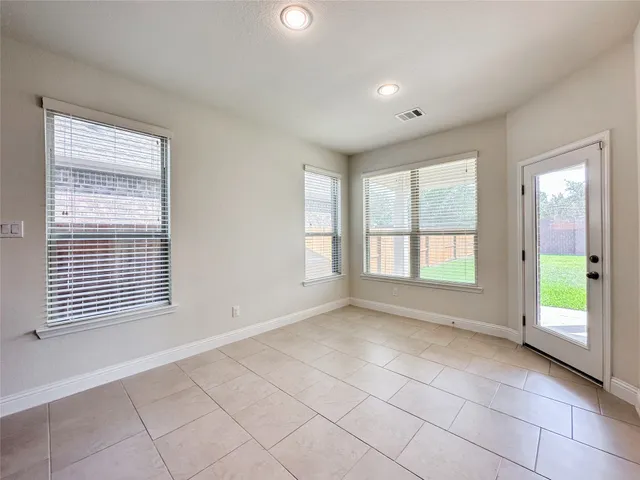 a spacious bathroom with a bathtub and a sink
