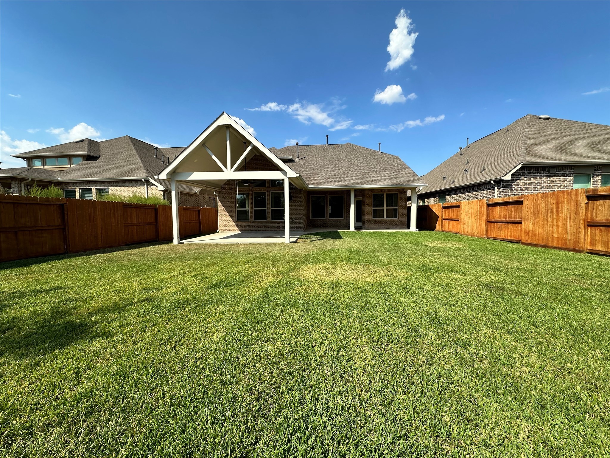 6715 Chicoma Street Spring, TX 77379 - Photo 17 of 20 a front view of a house with yard and green space