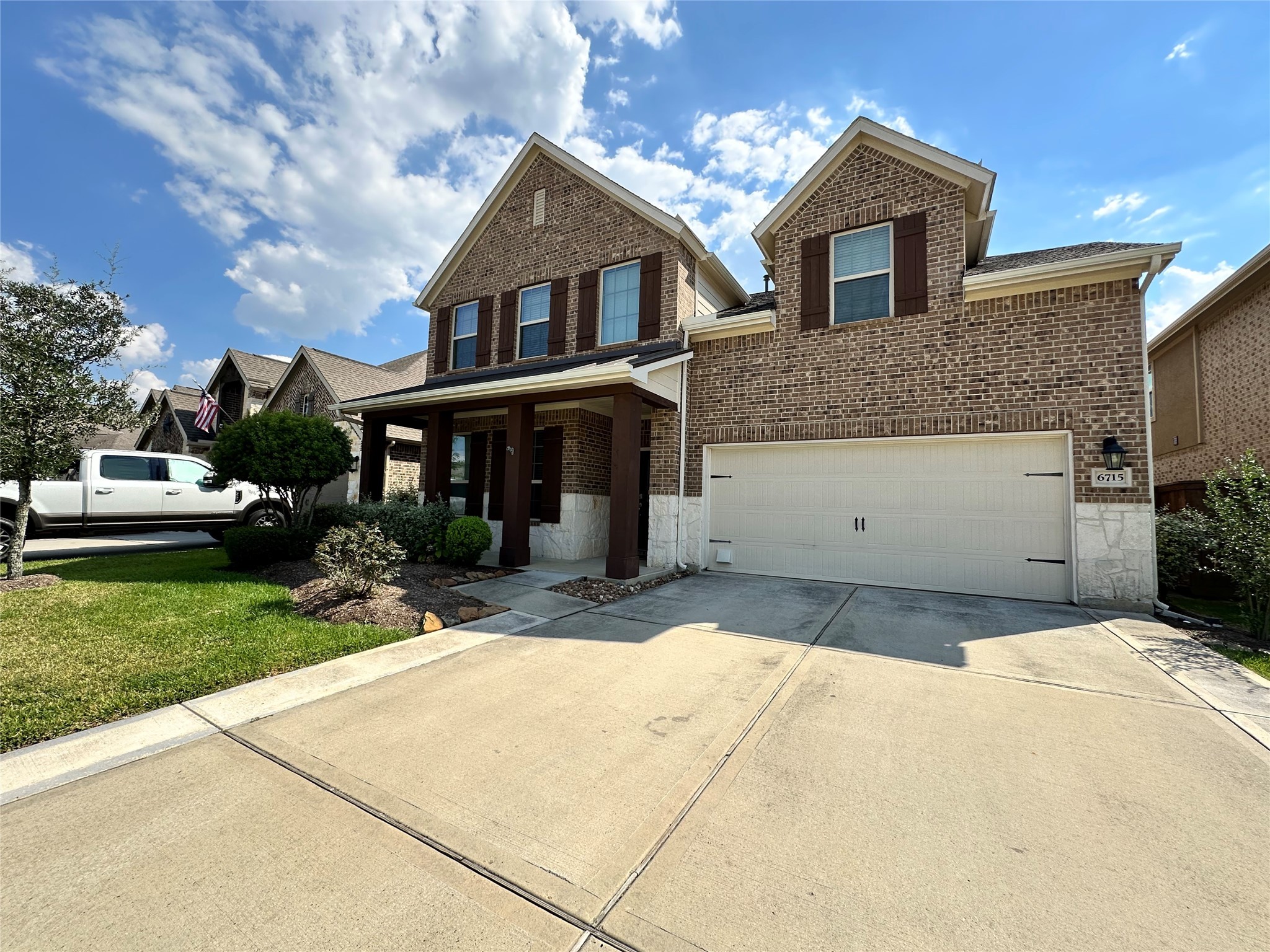 6715 Chicoma Street Spring, TX 77379 - Photo 3 of 20 a front view of a house with a yard and garage