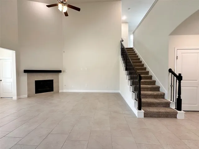 a view of an empty room with stairs