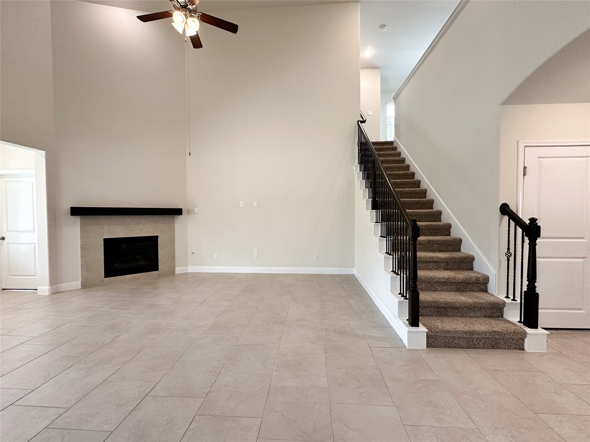 6715 Chicoma Street Spring, TX 77379 - Photo 8 of 20 a view of an empty room with stairs