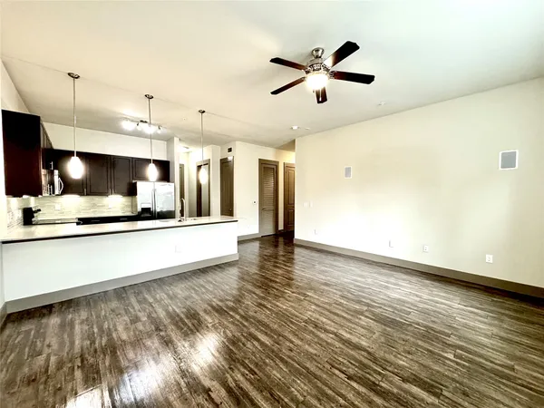 a view of a kitchen counter top space and stainless steel appliances