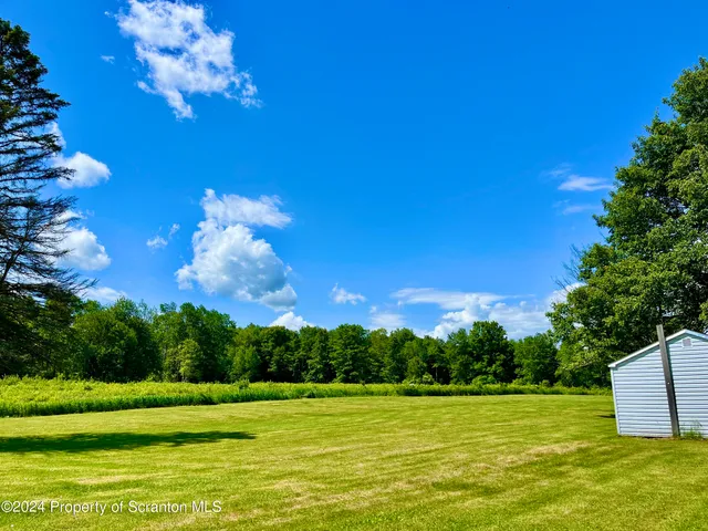a view of a golf course with a lake