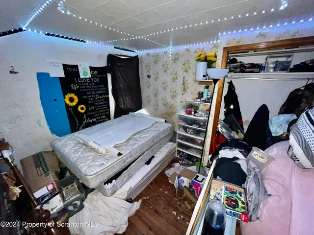 a bed room with a bed and gym equipment