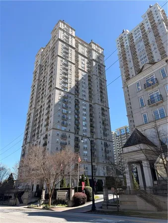 a tall building sitting on the side of a street