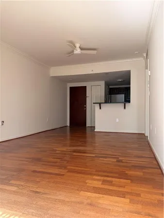 a view of a kitchen with a sink and microwave
