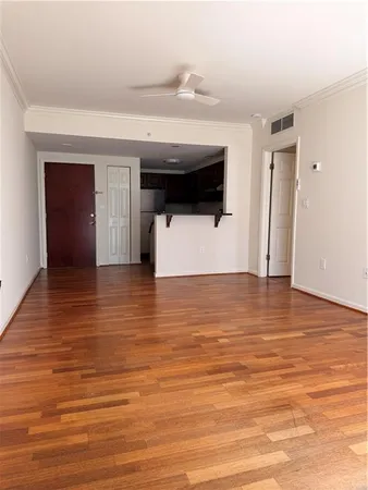 a view of a living room with furniture and a flat screen tv