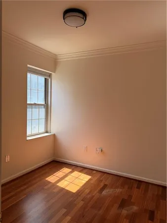 an empty room with a empty space and a window