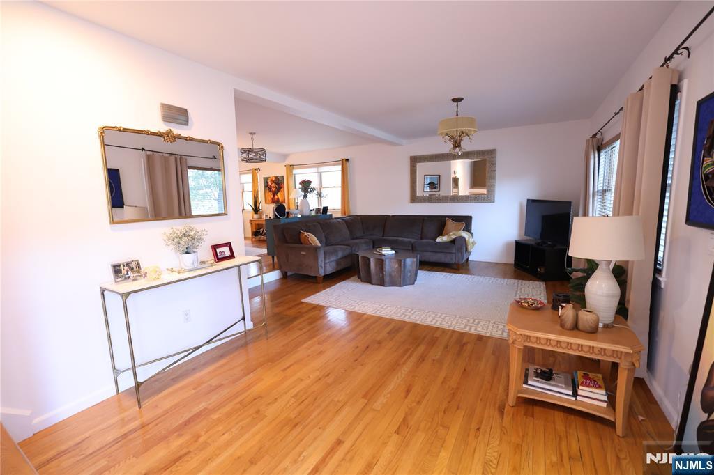 59 Spring Valley Avenue Hackensack, NJ 07601 - Photo 2 of 26 a living room with furniture and a wooden floor