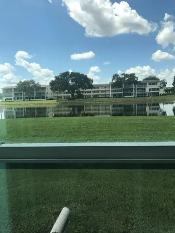 a view of a golf course with a lake