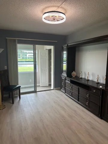 an empty room with closet and mirror