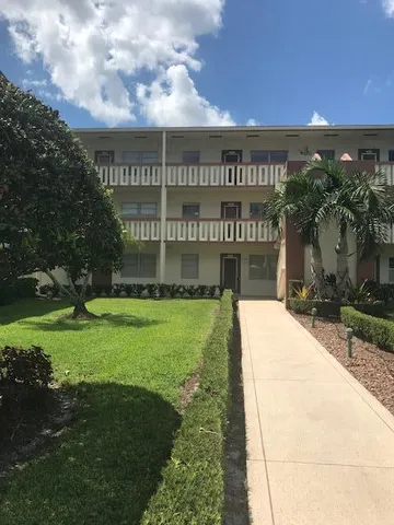 a view of a floor to ceiling window and an ocean view