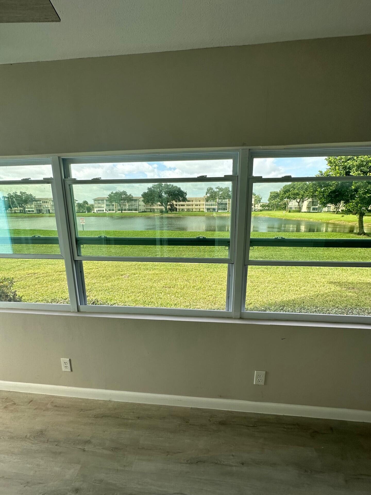 340 Mansfield Drive Boca Raton, FL 33434 - Photo 22 of 23 a view of a floor to ceiling window and an ocean view