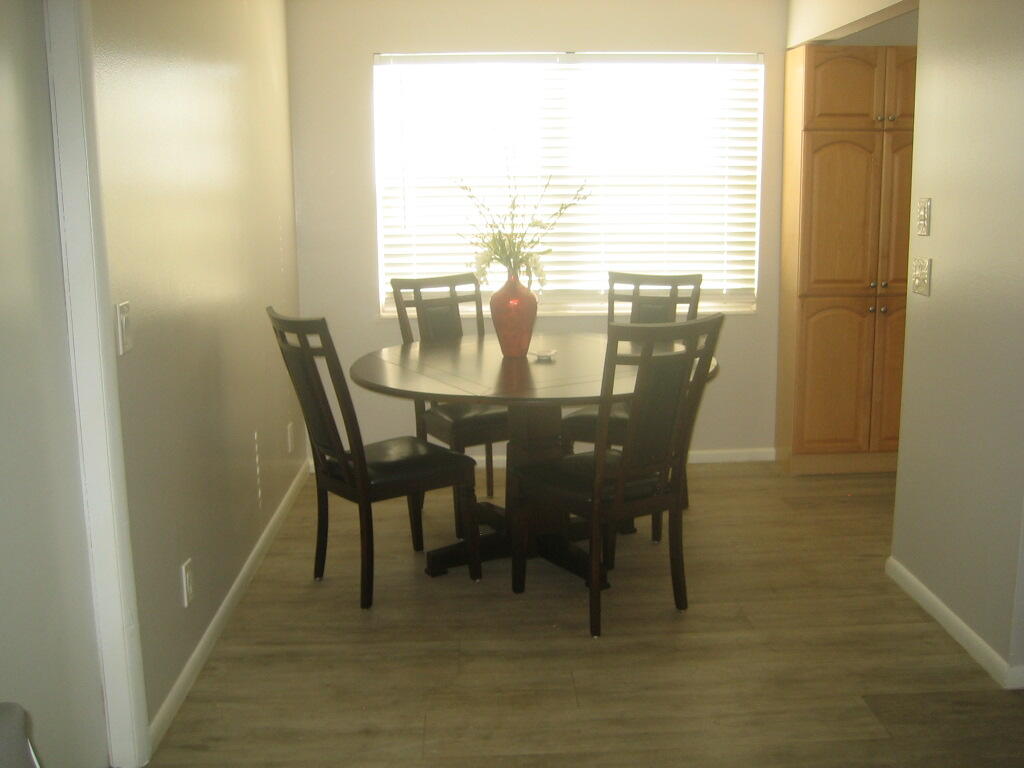 340 Mansfield Drive Boca Raton, FL 33434 - Photo 3 of 23 a view of a dining room with furniture and wooden floor