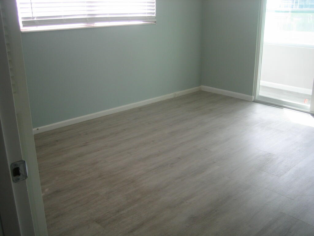 340 Mansfield Drive Boca Raton, FL 33434 - Photo 7 of 23 a view of a small space with wooden floor and a window