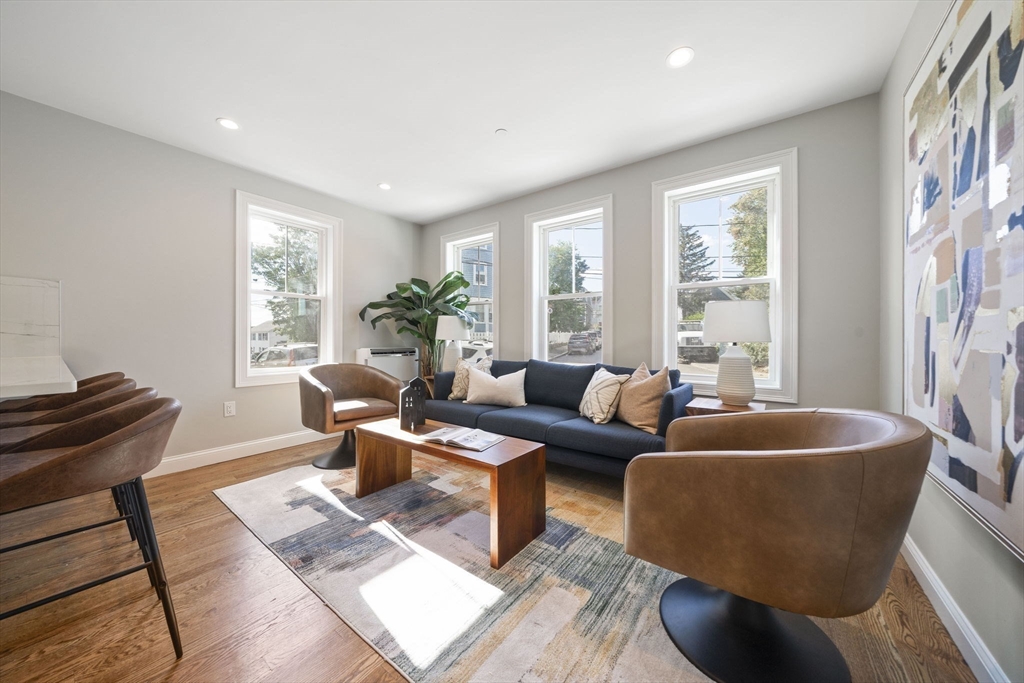52 Bellevue Street, Unit 1 Boston, MA 02125 - Photo 8 of 16 a living room with furniture and a potted plant