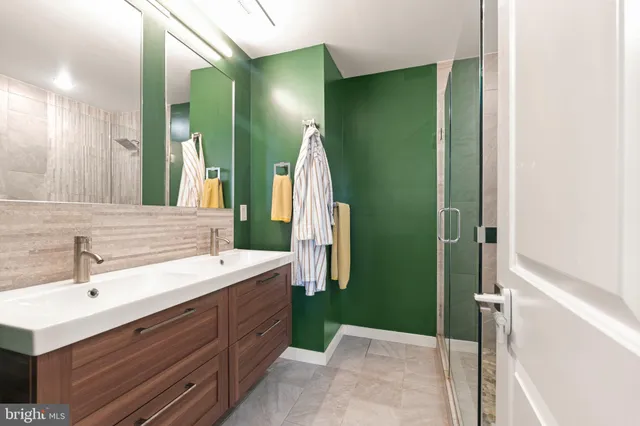 a bathroom with a sink and mirror