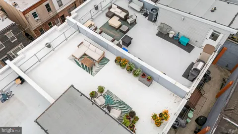 an aerial view of a house with wooden stairs