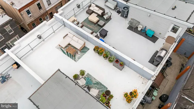 an aerial view of a house with wooden stairs