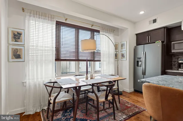 a view of a dining room with furniture and a window