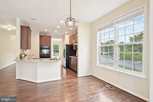 a view of livingroom with furniture window and front door