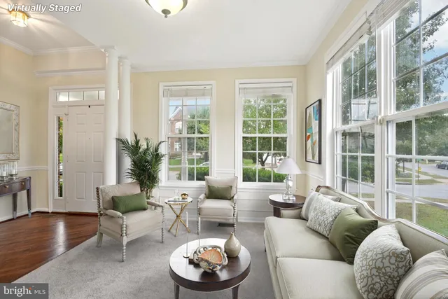 a view of a hallway with wooden floor and a cabinet