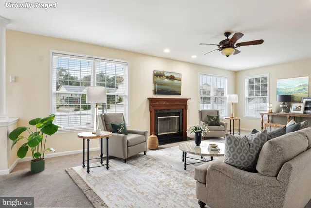 a kitchen with granite countertop wooden cabinets a refrigerator and a sink