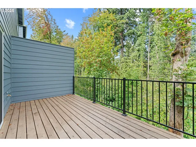 a view of balcony with wooden floor