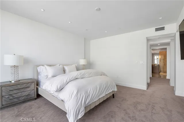 a bedroom with bed and a closet