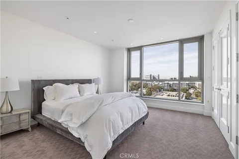 a bathroom with a granite countertop sink a large mirror and a shower