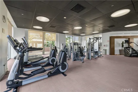 a room with furniture pool table and windows
