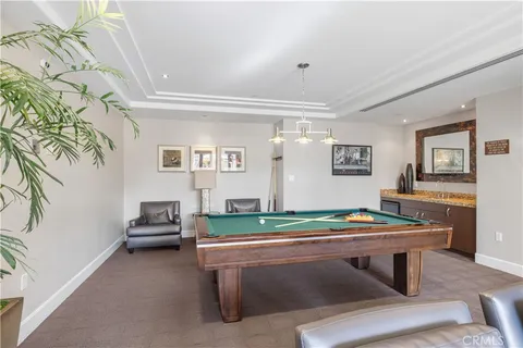 a view of swimming pool with outdoor seating and yard in the back