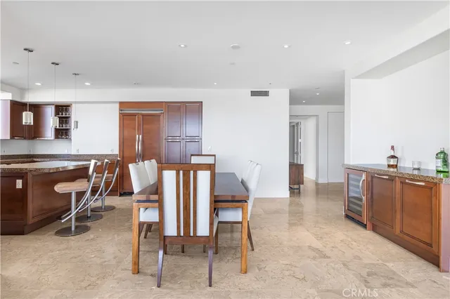 a living room with furniture a dining table and a piano