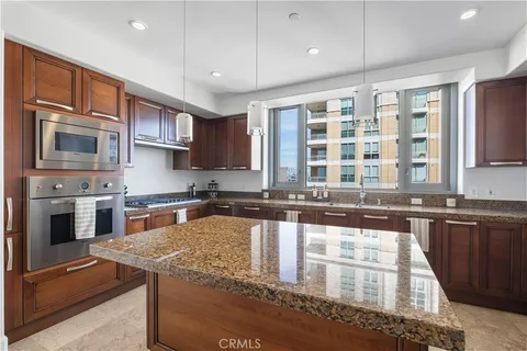 a large kitchen with granite countertop lots of counter top space