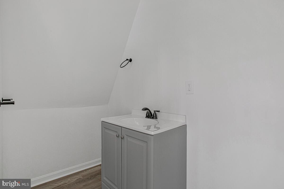 1660 Bay Ridge Road Edgewater, MD 21037 - Photo 24 of 33 a bathroom with a sink and mirror