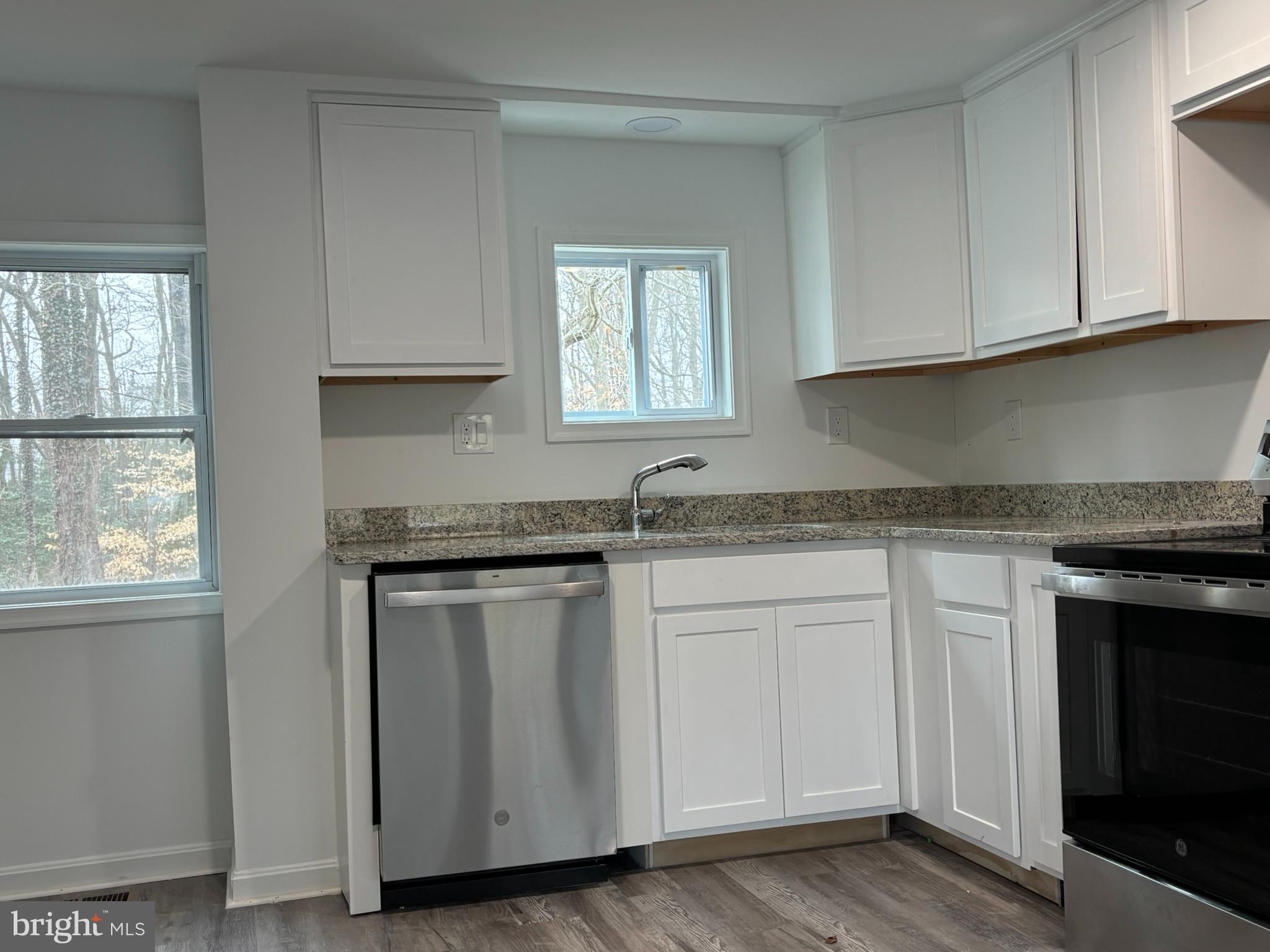 1660 Bay Ridge Road Edgewater, MD 21037 - Photo 8 of 33 a kitchen with granite countertop white cabinets and a stove