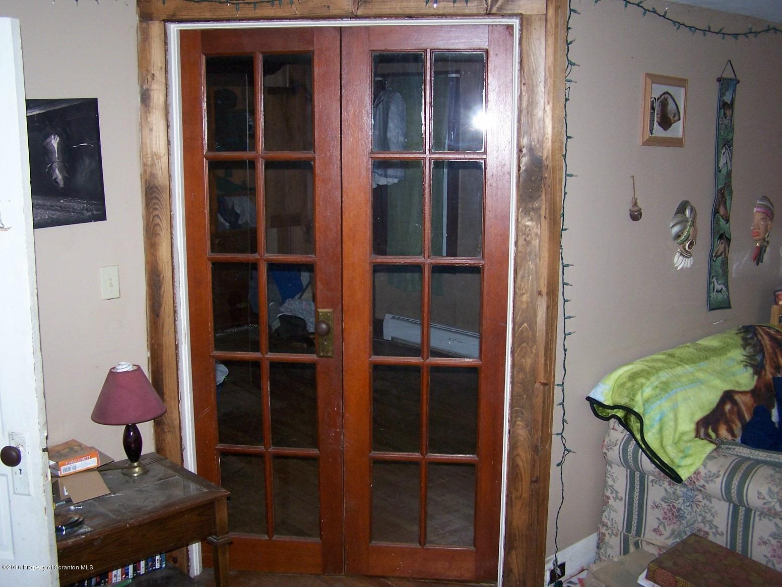 384 State Rte 2024 Montrose, PA 18801 - Photo 19 of 35 a view of a room that has a bed and a chair in it